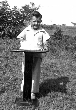 Young Larry standing at a podium
